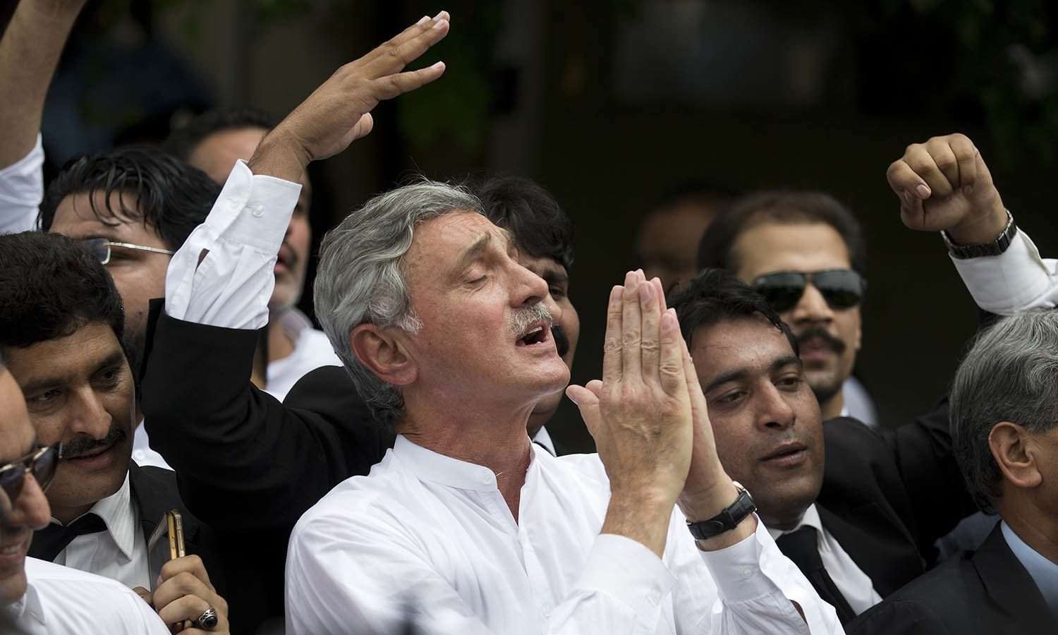Senior opposition politician Jehangir Tareen celebrates the dismissal of Pakistani Prime Minister Nawaz Sharif outside the Supreme Court in Islamabad, Pakistan, Friday, July 28, 2017. Pakistan's Supreme Court in a unanimous decision has asked the country's anti-corruption body to file corruption charges against Sharif, his two sons and daughter for concealing their assets. (AP Photo/B.K. Bangash)